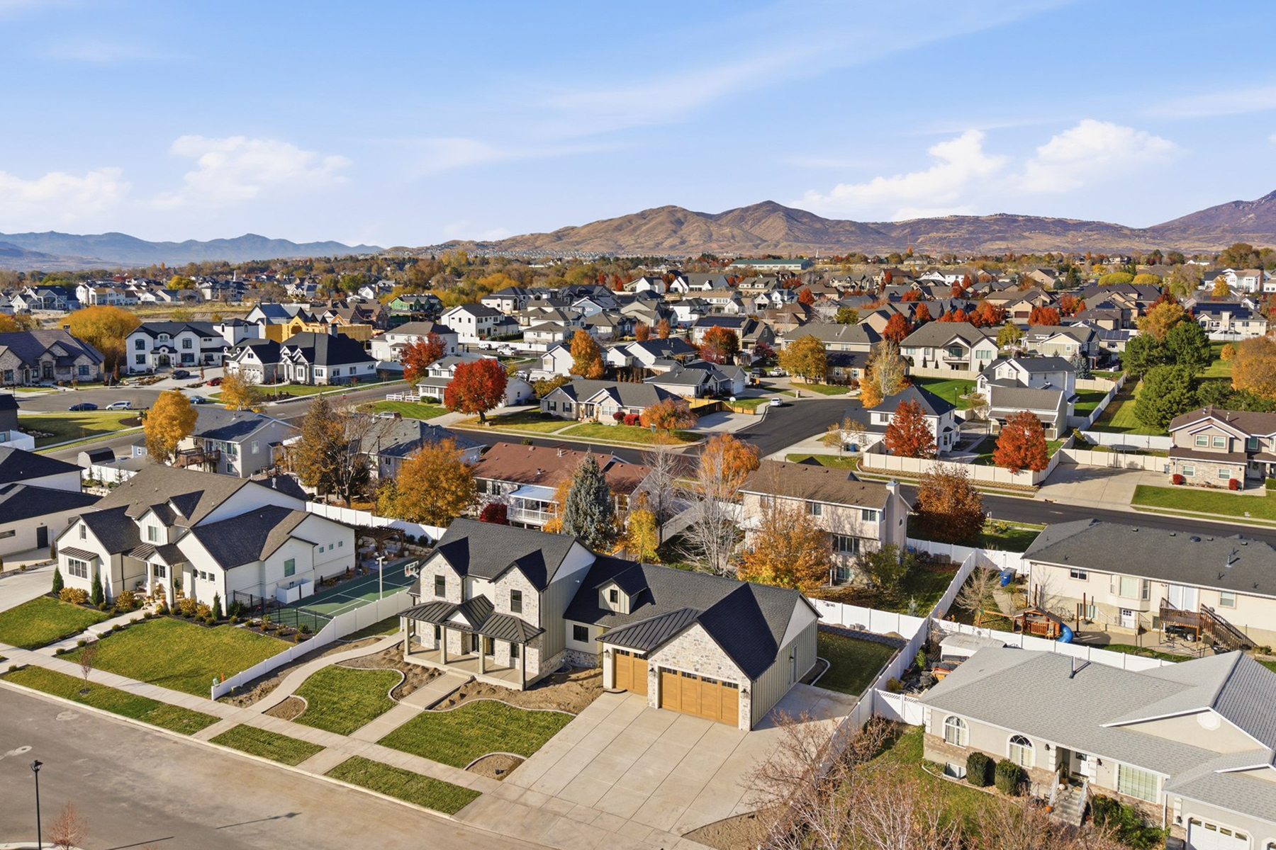 Utah residential neighborhood with autumn trees and mountain setting